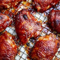 chicken wings covered in marinara sauce cooling on a wire rack, ready to be cooked