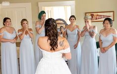 a bride and her bridal party in the mirror