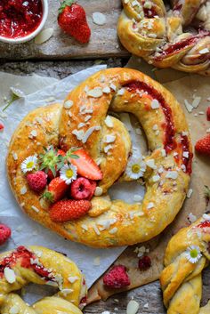 strawberry cream filled pretzels with fresh strawberries and almonds on the side