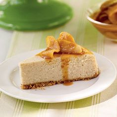 a slice of cheesecake with caramel sauce on top