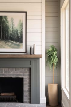 a living room with a fire place and a painting on the wall above it's mantle