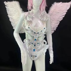 a white mannequin with pink hair and wings