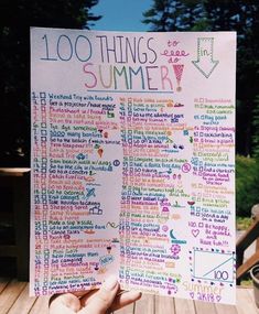 someone holding up a poster with the words 100 things to do in summer