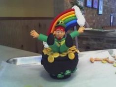 a cake with a lepretiun sitting on top of it