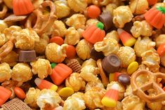 close up view of halloween popcorn with candy corn and pretzels