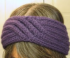 a close up of a woman wearing a purple headband