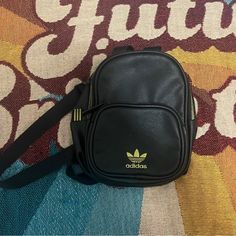 Black Nylon Adidas Small Back Pack. Great For Festivals Or Concerts. Purchased New But Never Used. Black Nylon Shoulder Bag For Back To School, Trendy Black Backpack For Streetwear, Black Nylon Crossbody Backpack, Streetwear Black Backpack With Zipper Pocket, Casual Adidas Shoulder Bag For School, Black Backpack With Zipper For Streetwear, Black Backpack With Zipper Closure For Streetwear, Black Backpack With Zipper Pocket For Streetwear, Adidas Nylon Backpack For Everyday