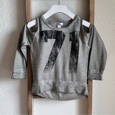 Brand New, Never Worn Super Cute Grey/Black Cold Shoulder Long Sleeved Top By Xhilaration Sz: 4/5 Girls Graphic Print Tops For Playwear In Fall, Winter Letter Print Top For Playwear, Winter Tops With Letter Print For Playwear, Distressed Gray Tops For Fall, Trendy Gray Distressed Tops, Trendy Distressed Gray Tops, Fall Playwear Crew Neck Tops, Crew Neck Tops For Playwear In Fall, Crew Neck Tops For Fall Playwear