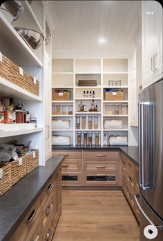 a kitchen with lots of shelves and drawers