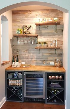 a wine cellar with shelves and bottles on the wall