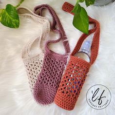 two crocheted purses sitting next to each other on a white furnishing