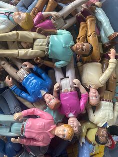 a pile of toy figurines sitting on top of each other