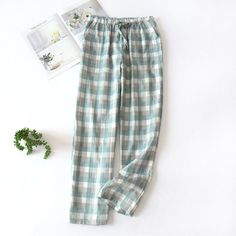 The Plaid Long Pajama Pants Original Pajamas are fitted with an elastic waist and a drawstring to give you a custom fit. The loose-fitting design of these warm pajama pants made for unrestricted movement all day and night!! We are passionate about fabric and textile materials and have thus created the best, most comfortable yet practical line of pajamas. This loungewear is all you need to help relax at home. They are soft and easy to touch which projects versatility and effortless grace in every step you take. Made to make you feel good, each of our Original Pajamas is an expression of our love for self-care, practicality and a dash of flirty fun. How it’s made: Each of the pajamas is sourced from the finest quality fabric, sewn together by quality workmanship. Made with cotton Non-bleedin Comfortable Cotton Sleep Pants, Sleepwear Trousers With Pockets For Loungewear, Trousers Sleepwear With Pockets For Loungewear, Casual Cotton Pajama Party Pants, Green Cotton Sleepwear With Pockets, Cotton Sleep Pants With Pockets, Casual Cotton Pants For Pajama Party, Cotton Sleepwear Trousers With Elastic Waistband, Cotton Sleepwear With Elastic Waistband