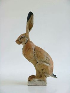 a statue of a rabbit sitting on its hind legs