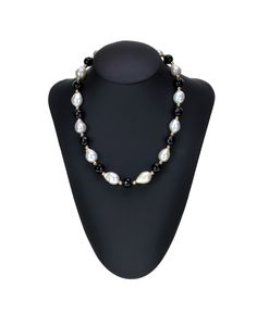 Stand-out in the crowd with this strand necklace 18 inches long. This necklace is design with alternating 12-13mm white baroque freshwater cultured pearl, 10mm black onyx, and 4mm 14k yellow gold beads. A 14k yellow gold fish-hook clasp is securing the necklace. 100% natural color pearls, and they have not been dyed or color treated, with some ivory to silvery hue Gold Fish, Hook Clasp, Goldfish, Strand Necklace, Fish Hook, Gold Beads, Black Onyx, Natural Color, Fresh Water