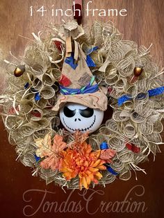 a halloween wreath with a skeleton wearing a hat