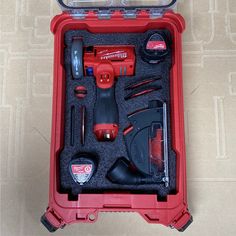 a red tool box with tools in it