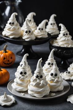 A photo of a  Ghostly Meringues which is a type of halloween treat recipes Spooky Halloween Food For Kids, Cute Halloween Baking Ideas, Halloween Truffle Ideas, Halloween Tea Party Food, Halloween Spooky Treats, Cute Halloween Recipes, Halloween Bakery Ideas, Simple Halloween Food Ideas, Halloween Food Ideas Desserts