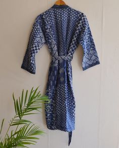 DescriptionCotton Kantha Robe made From Hand Block Printed Fabric.It is hand printed fabric using natural dyes.Item - Indian Handmade Women Kantha Robe Bathrobe Kimono Dress , Gown , Beach Cover up , RobeMaterial - Pure CottonSize - One Plus ( Free Regular ) One size (plus) US women's letterProduct: 1 PC Floral Printed Cotton KimonoMeasurements or Sizes:Length- 52 InchesBust- 48 inchesSleeve-14 inchesSize: Free Size KimonoMain Color: - BlueSecondary Color :- WhiteNote: The color and brightness o Traditional Cotton Home Robe, Traditional Cotton Robe For Home, Traditional Long Sleeve Loungewear Dress, Embroidered Long Sleeve Robe For Loungewear, Long Sleeve Cotton Kimono For Sleep, Long Sleeve Cotton Sleep Kimono, Traditional Long Sleeve Blue Robe, Blue Cotton Long Sleeve Kimono, Blue Long-sleeved Cotton Kimono