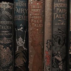 old books are lined up on a shelf