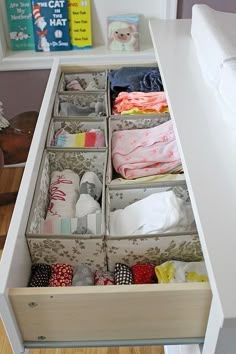 an organized drawer is shown in this kitchen