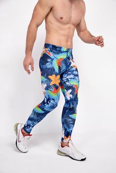 Description: Blue Jungle Print Men's Leggings Breathable & Moisture Wicking 4-Way Stretch Fabric Machine Wash Cold, Quick Drying High Stretch Nylon / Spandex Bolt Logo Patch This design does not have pockets Model is 6’2’’ (189cm) tall, 34’’ (86cm) waist and wears size Large. Blue 4-way Stretch Bottoms For Outdoor, Blue Sportswear Pants For Running, Casual Blue Leggings For Running, Blue 4-way Stretch Bottoms For Training, Blue Tight Training Pants, Blue Tight Pants For Training, Tight Blue Training Pants, Blue Tight Sportswear Bottoms, Tight Blue Sports Pants