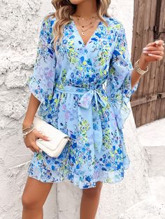 Flirty, flowy, and fabulously femme, our Sienna Floral Wrap Mini Dress is a must-have for any fashion-forward babe. Made with lightweight chiffon fabrication, this dress will keep you cool and chic all season long. Embrace your inner flower child with this playful and versatile piece. Size Guide: Model is 5’8” tall, and has a 33.4” bust, 26.4” waist, & 35.4” hips. She is wearing a S / US 4 / AU 8. This dress is true to size. Material: 100% Polyester. Feature: V-Neckline. Wrap front with waist tie. Short ruffle sleeves. Floral Print. Chiffon Fabrication. Mini length. Care Instructions: Machine wash / Cold hand wash Blue A-line Chiffon Dress For Summer, Breezy A-line Spring Dress, Flowy Summer Casual Chiffon Dress, Casual Summer Flowy Chiffon Dress, Summer Casual Flowy Chiffon Dress, Flowy Casual Chiffon Dress For Spring, Flowy Chiffon Dress For Spring, Spring Chiffon Beach Dress, Flowy Chiffon Dress For Summer Day Out