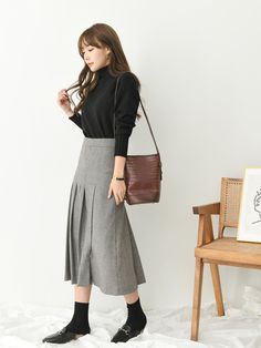 Pleated wool blend skirt, midi length. Model is in MINUSEY S. Please allow 5-12 days to ship when in restocking. * MINUSEY S = EU 34, US 2* MINUSEY M = EU 36, US 4* Wool Blend* Dry clean* Made in Korea - Model Height: 163cm/5'3" (US2, EU34) Winter Office Lady Skirt, Office Winter Pencil Skirt, Elegant Wool Pleated Skirt For Work, Office Wool Skirt With Lining, Office Wool Lined Skirt, Business Casual Midi Length Bottoms For Fall, Office Wool Flared Skirt, Flared Skirt For Workwear In Fall, Winter Workwear Pencil Skirt