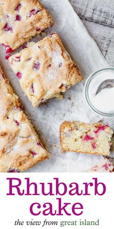 rhubarb cake is cut into squares and served with a glass of milk