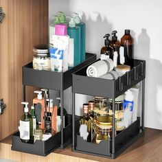 two bins with different types of bathroom items in them on a wooden countertop