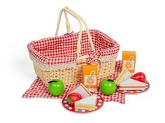 a picnic basket with apples, cheese and crackers