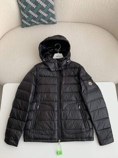 Embrace timeless style and exceptional warmth with this Moncler Maya-inspired men's jacket in classic black. Crafted with meticulous attention to detail, this puffer jacket features a sleek silhouette and premium down-filling for superior insulation against the cold. The attached hood provides added protection from the elements, while the signature Moncler logo patch on the sleeve adds a touch of understated luxury. Whether hitting the slopes or braving the city streets, this jacket is the perfe Luxury Black Hooded Jacket For Winter, Black Duck Down Hooded Jacket With Detachable Hood, Luxury Black Winter Hooded Jacket, Luxury Hooded Duck Down Puffer Jacket, Luxury Black Duck Down Outerwear, Luxury Black Down Puffer Jacket, Luxury Black Puffer Jacket With Detachable Hood, Luxury Fitted Men's Puffer Jacket, Luxury Hooded Men's Puffer Jacket