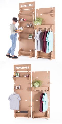 two cardboard shelves with clothes hanging on them and one holding a plant in the middle