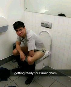 a man squatting down in front of a toilet with the caption getting ready for birmingham