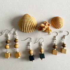 Handcrafted Wooden Beaded Dangle Drop Handmade Boho Earrings Fun Gift for her. Color and length variations. Length approximately 1.7-2.3 inch  Hypoallergenic silver tone hooks. Unique handcrafted jewelry from carefully curated vintage and repurposed accessories, offering timeless style with a sustainable glamour. #artisan, artistic, artsy, boho, bohemian, chic, dangle, drop, earthy, festive, fun, event, gift, hand crafted, hand created, handmade, hippie, jewelry, limited edition, repurposed, uni Natural Beaded Jewelry For Gifts, Wooden Beads Round Beaded Earrings As Gift, Gift Wooden Beaded Round Earrings, Adjustable Silver Beaded Earrings As Gift, Adjustable Dangle Jewelry With Wooden Beads, Gift Wooden Beaded Earrings, Adjustable Wooden Beaded Earrings As Gift, Adjustable Silver Jewelry With Wooden Beads, Wooden Beads Dangle Earrings