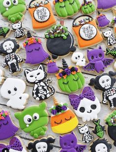 halloween decorated cookies are displayed on a table