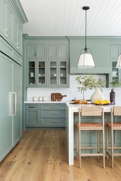 the instagram page shows an image of a kitchen with blue cabinets and wood floors