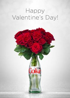 a coke bottle with roses in it and the words happy valentine's day