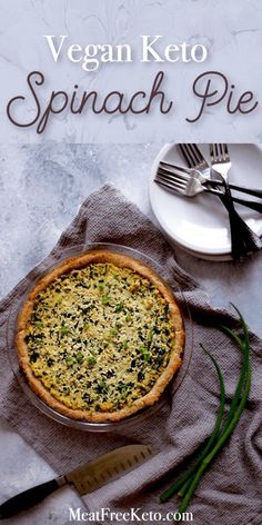 vegan keto spinach pie on a plate with fork and knife next to it