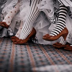 two legs in striped stockings and high heels