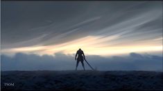 a man standing on top of a grass covered field next to a sky filled with clouds