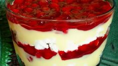 a red and white trifle in a glass dish