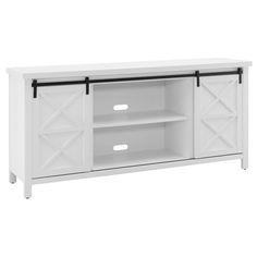 a white tv stand with two doors and three drawers on the bottom, one door open