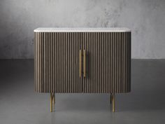 the sideboard is made out of wood and white marble