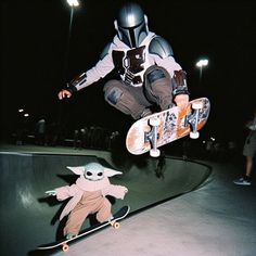 a person on a skateboard in the air with a yoda doll next to him