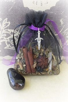 Protection Mojo Bag, Protection Amulet Bag, Protection Spell, Herbal Bag, Gris Gris Bag, Sachet Bag, Witchcraft Supplies, Wicca Charm Bag Mojo bags are wonderful tools because they are carried with you or sewn into clothing, combined with your own energy makes their magick very powerful. This Protection Mojo Bag is specially made to aid  in protection both physically and mentally. This amulet bag contains anise star, cinnamon sticks, crystal quartz, obsidian, black cat hair, mugwort, basil and other resins and herbs.  Includes a 3 x 5 organza bag adorned with a purple organza ribbon and a Tibetan Silver Protection Charm.  * Listing does not include the large obsidian stone used in photo. DISCLAIMER: The Witches Curio shall not be held responsible for any injuries, damages, or losses result Anise Star, Amulet Bag, Wiccan Crafts, Witch Bottles, Mojo Bags, Pagan Crafts, Magia Das Ervas, Wiccan Magic, Protection Spell