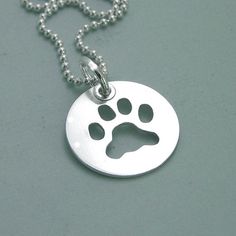 Hypoallergenic Sterling Silver Dog Tag Jewelry, Silver Hypoallergenic Dog Tag Jewelry, Hypoallergenic Silver Dog Tag Jewelry, Silver Paw Print Round Pendant Necklace, Sterling Silver Jewelry With Paw Print, Silver Jewelry With Paw Print, Sterling Silver Paw Print Necklace, Hand Piercing, Paw Print Necklace