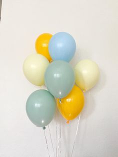 a bunch of balloons sitting on top of a table