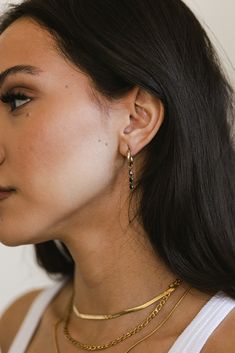 Lily - Gold Three Black Diamond Huggies earrings are both waterproof and tarnish resistant. Perfect for any occasion, these limited-time earrings add a touch of elegance to any outfit. Don't miss out on this high-quality piece while it's still available. MATERIAL: 18k PVD Gold Plated, Stainless Steel, CZ Water resistant, tarnish resistant, hypoallergenic, & nickel/lead free. Diamond Huggie Earrings, Diamond Huggies, Waterproof Jewelry, Huggie Earrings, Bar Accessories, Huggies Earrings, Ring Bracelet, Earring Necklace, Black Diamond