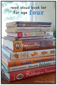 a stack of children's books sitting on top of a table with the words read aloud book list for age four